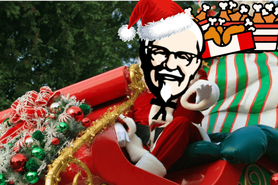 KFC:n maskotti eversti Sanders ajaa joulupukin rekeä lahjoinaan kanaämpäreitä.