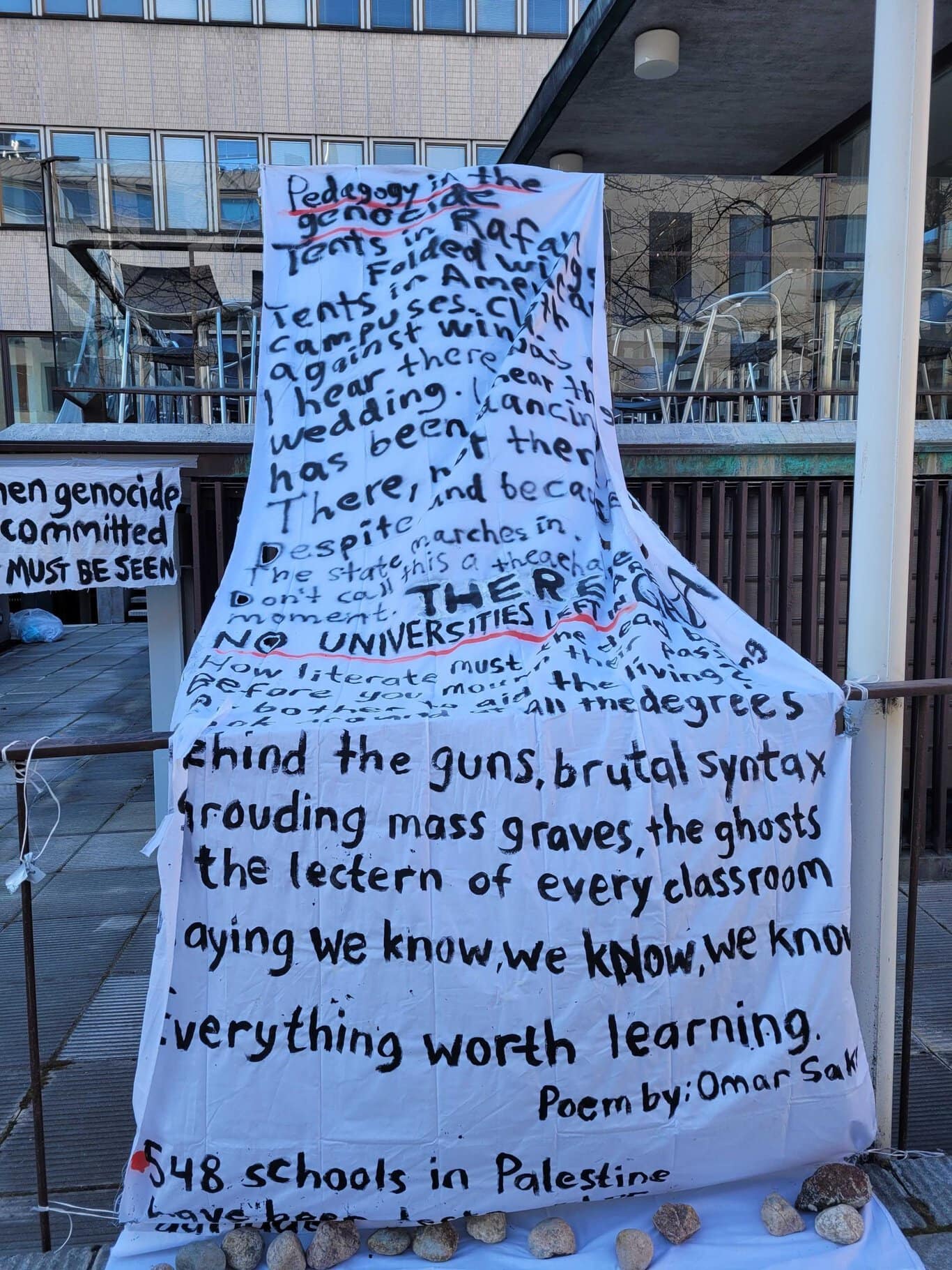A big hand written sign with a poem written on it.
