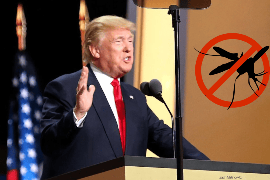 Donald Trump pitää puhetta. Hänen vieressään on "ei hyttysiä" -kyltti.