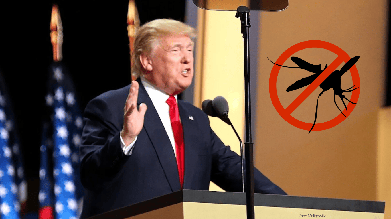 Donald Trump pitää puhetta. Hänen vieressään on "ei hyttysiä" -kyltti.
